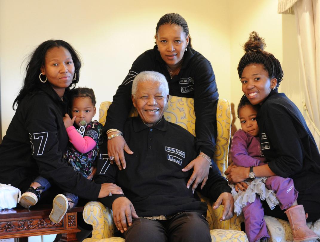 In this hand out photograph supplied by Peter Morey Photographic for the Mandela family, showing former South Africa president Nelson Mandela, center, with family members left to right Zaziwe Manaway, Ziphokazi Manaway, Zamaswazi Dlamini and Zamak Obiri at Mandela's hometown in Qunu, South Africa, Sunday July 17, 2011. Mandela celebrates his 93rd birthday Monday July 18, 2011. Center back is Mandela';s daughter Princess Zenani Dlamini. (AP Photo/Peter Morey Photographic-HO) NO SALES, EDITORIAL USE ONLY