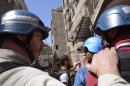U.N. chemical weapons experts visit one of the sites of an alleged chemical weapons attack in Damascus' suburbs of Zamalka
