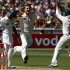 Australia's Bird celebrates with team mate Hughes after taking the wicket of Sri Lanka's Karunaratne for five runs during the first day of the second cricket test at the Melbourne Cricket Ground