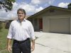 In this Sept. 12, 2012, photo, Andrew Neitlich poses in front of one his investment homes in Venice, Fla. Neitlich once worked as a financial analyst picking stocks for a mutual fund. During the dot-com crash 12 years ago, Neitlich didn't sell his stocks, but like many others he is selling now.  An analysis by The Associated Press finds that individual investors have pulled at least $380 billion from U.S. stock funds since they started selling in April 2007.  (AP Photo/Chris O'Meara)