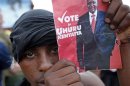 Supporter of presidential candidate Uhuru Kenyatta celebrates on the outskirts of Nairobi