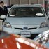 A Toyota Motor Corp Prius vehicle and other vehicles are displayed at the company's showroom in Tokyo