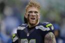 FILE - In this Dec. 27, 2015, file photo, the Seattle Seahawks' Cassius Marsh stands on the field against the St. Louis Rams in the first half of an NFL football game in Seattle. Marsh pleaded on Twitter on Nov. 9, 2016, for the person who stole his valuable collection of "Magic: The Gathering" cards to return them. (AP Photo/John Froschauer, File)