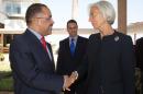 This handout photo released by the International Monetary Fund shows IMF Managing Director Christine Lagarde (R) and Mozambique's Finance Minister Manuel Chang on May 28, 2014 in Maputo