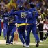 Sri Lanka's Kulasekara celebrates with team mates after dismissing Australia's Warner for seven runs during the Twenty20 international cricket match at the Melbourne Cricket Ground