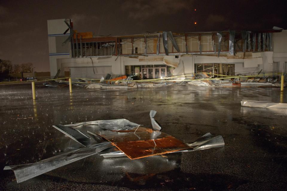 The Books-A-Million store is seen damaged by heavy wind and rain during a major storm in Monroe, La., Saturday, Dec. 21, 2013. (AP Photo/Matthew Hinton)