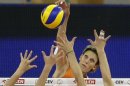 Visser of the Netherlands spikes the ball past Belgium's team during their European Women Volleyball Championships in Lodz