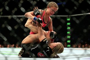 Paige VanZant works Felice Herrig during their UFC strawweight fight. (Getty)