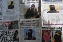 An arrangment of British daily newspapers photographed in London on February 27, 2015 shows the front-page headlines and stories regarding the identification of the masked Islamic State group militant dubbed "Jihadi John"