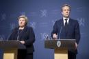 Norway's Prime Minister Erna Solberg and Foreign Minister Borge Brende attend a news conference in Oslo