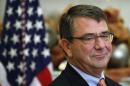 Former Pentagon official Ash Carter listens as he is nominated by U.S. President Barack Obama to be Obama's next defense secretary, at the White House in Washington