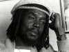 FILE - In this Feb. 1979 file photo, Jamaican reggae singer Peter Tosh is shown in the office of a record company in Hollywood, California. For his musical contributions, Tosh's daughter, Niambe, received on Monday, Oct. 15, 2012, the posthumous "Order of Merit" for her father, during the island's annual national heroes ceremony. Tosh, a founding member of the reggae band The Wailers along Bob Marley and Bunny Wailer, was killed in 1987 at age 42 by robbers who broke into his Jamaican home. (AP Photo/File)