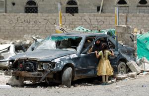 A Yemeni woman inpect a damaged car in a residential&nbsp;&hellip;