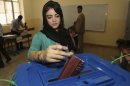 FILE - In this Sept. 21, 2013 file photo, An Iraqi Kurdish woman casts her ballot in a regional election in Irbil, Iraq. The leading party in Iraq's northern self-ruled Kurdish region has won the largest bloc in the local legislature, gaining eight seats. Kurds have enjoyed autonomy since 1991, when a U.S.-British no-fly zone helped protect them from Saddam Hussein's forces until his fall in the 2003 U.S.-led invasion. Since then, the region has been largely peaceful compared to the rest of Iraq. (AP Photo/ Khalid Mohammed, File)