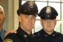 In this 2010 photo provided by the Massachusetts Bay Transportation Authority, Richard Donohue Jr., left, and Sean Collier pose together for a photo at their graduation from the Municipal Police Officers' Academy. On Thursday, April 18, 2013, Massachusetts Institute of Technology Police Officer Collier was fatally shot on the MIT campus, and transit police officer Donohue was shot and critically wounded. Authorities allege that Boston Marathon bombing suspects Tamerlan and Dzhokhar Tsarnaev were responsible. (AP Photo/Massachusetts Bay Transportation Authority)