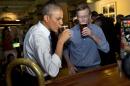 President Barack Obama has a beer at Wynkoop Brewing Co. with Colorado Gov. John Hickenlooper on Tuesday, July 8, 2014, in Denver. (AP Photo/Jacquelyn Martin)