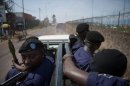 Policemen drive through the street in Goma in the east of the Democratic Republic of the Congo on December 4, 2012