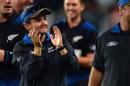 New Zealand's head coach Mike Hesson celebrates his team's win during the Cricket World Cup semi-final match between New Zealand and South Africa at Eden Park in Auckland on March 24, 2015