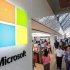 FILE - In this Thursday, Aug. 23, 2012 file photo, the Microsoft Corp. logo, left, is seen on an exterior wall of a new Microsoft store inside the Prudential Center mall, in Boston. Microsoft will use its annual developers conference to release a preview of Windows 8.1, a free update that promises to address some of the gripes people have with the latest version of the company’s flagship operating system. The Build conference, which starts Wednesday, June 26, 2013, in San Francisco, will give Microsoft’s partners and other technology developers a chance to try out the new system before it becomes available to the general public later in the year. (AP Photo/Steven Senne, File)