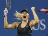 Maria Sharapova of Russia celebrates match point to defeat Nadia Petrova of Russia during their match at the US Open