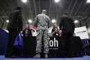 Jobseekers talk to recruiters from Yoh, a staffing agency, during a Hire Our Heroes job fair targeting unemployed military veterans and sponsored by the Cable Show, a cable television industry trade show in Washington