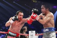 Juan Manuel Marquez (L) of Mexico punches at Manny Pacquiao of the Philippines during their welterweight fight at the MGM Grand Garden Arena in Las Vegas, Nevada December 8, 2012. REUTERS/Steve Marcus