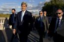 US Secretary of State John Kerry walks in Paris on October 13, 2014