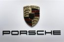 A logo is seen on the Porsche booth on media day at the Paris Mondial de l'Automobile