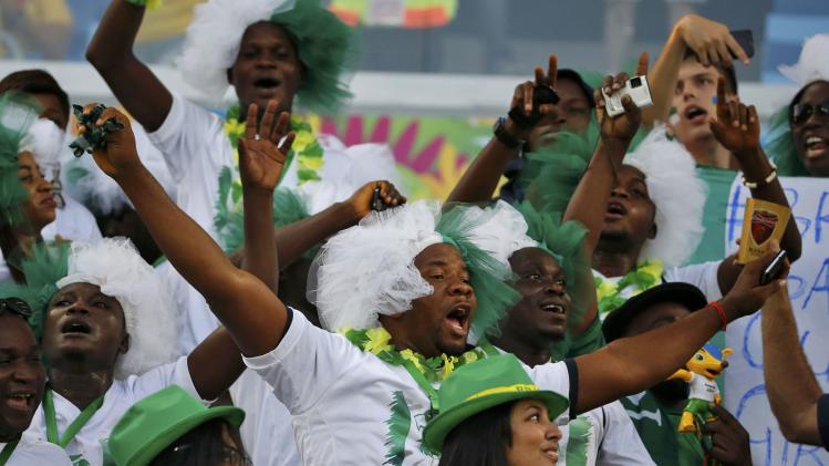 Nigeria fans cheer before the 2014 World Cup Group F soccer match between Nigeria and Bosnia at the Pantanal arena in Cuiaba