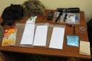 In this handout photo provided by the FSB, acronym for Russian Federal Security Service, wigs and spying gadgets carried by a man claimed by FSB to be Ryan Fogle, a third secretary at the U.S. Embassy in Moscow, when he was detained, are shown in the FSB offices in Moscow, early Tuesday, May 14, 2013. Russia's security services say they have caught a U.S. diplomat who they claim is a CIA agent in a red-handed attempt to recruit a Russian agent. Ryan Fogle, a third secretary at the U.S. Embassy in Moscow, was carrying special technical equipment, disguises, written instructions and a large sum of money when he was detained overnight, the FSB said in a statement Tuesday. Fogle was handed over to U.S. embassy officials, the FSB, said. (AP Photo/FSB Public Relations Center)
