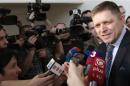 Slovakia's PM and presidential candidate Fico addresses the media after casting his vote in the village of Velke Dvorany