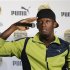 Jamaica's sprinter Bolt gestures at a news conference in Tokyo