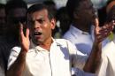 Maldivian presidential candidate Nasheed, who was ousted as president in 2012, gestures at a political march around the island in Mal