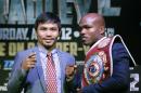 FILE - In this Feb. 6, 2014 file photo, boxer Manny Pacquiao, of the Phillipines, left, poses for a photo with current WBO World Welterweight champion Timothy Bradley of Indio, Ca., during a press conference in New York. Bradley believes former pound-for-pound king Pacquiao has lost his competitive fire heading into Saturday's, April 12, 2014 welterweight rematch in Las Vegas. (AP Photo/Kathy Willens)