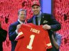 Tackle Eric Fisher from Central Michigan stands with NFL commissioner Roger Goodell after being selected first overall by the Kansas City Chiefs in the first round of the NFL football draft, Thursday, April 25, 2013 at Radio City Music Hall in New York.  (AP Photo/Mary Altaffer)