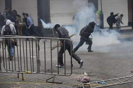 Teachers clash with the police during a violent eviction of Mexico City's Zocalo square, September 13, 2013