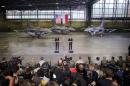 With F-16 fighters in the background, U.S. President Obama makes remarks next to Poland's President Komorowski at a military airport near Warsaw