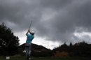 McDowell of Northern Ireland tees off as storm clouds gather during the second round of the World Challenge golf tournament in Thousand Oaks
