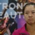 Tennis player Li Na of China attends a news conference for the Pan Pacific Open tennis tournament in Tokyo