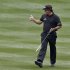 Phil Mickelson gives a thumbs-up to the cheering crowd as he walks up the 18th fairway during the final round of the Waste Management Phoenix Open golf tournament on Sunday, Feb. 3, 2013, in Scottsdale, Ariz. (AP Photo/Ross D. Franklin)
