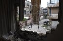 A view of a street seen from a damaged balcony in the Khaldiyeh district in central Homs