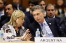 Argentina's President Mauricio Macri, right, listens to his Foreign Minister Susana Malcorra during a Mercosur Summit in Luque, Paraguay, Monday, Dec. 21, 2015. (AP Photo/Jorge Saenz)