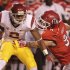 Southern California wide receiver Robert Woods (2) carries the ball as he breaks a tackle from Utah linebacker Trevor Reilly (9) in the first quarter during an NCAA college football game Thursday, Oct. 4, 2012, in Salt Lake City.  (AP Photo/Rick Bowmer)