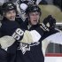 Pittsburgh Penguins' Beau Bennett (19) celebrates his goal with Kris Letang (58) during the first period against the New York Islanders in Game 1 of an NHL hockey Stanley Cup first-round playoff series, Wednesday, May 1, 2013, in Pittsburgh. (AP Photo/Gene J. Puskar)