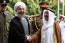 Iranian President Hassan Rouhani (L) greets the Emir of Kuwait, Sheikh Sabah al-Ahmad al-Sabah in Tehran on June 1, 2014