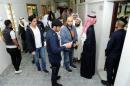 Kuwaiti men arrive to cast their votes during parliamentary election in a polling station in Kuwait City