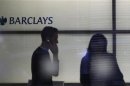 People walk inside Barclays Bank's headquarters in the financial district of Canary Wharf, east London