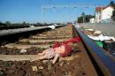 An abandoned doll lies on a rail track at the train station in Tovarnik