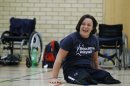 FILE - In this March 19, 2012 file photo, former marketing manager Martine Wright, works out in a gym with other members of the Great Britain sitting volleyball team, in London. Keep an eye out Friday, Aug. 31, 2012, for No. 7 when Britain plays Ukraine in its first match of the Paralympic Games sitting volleyball tournament. That's Martine Wright, a former marketing manager who was traveling on London's subway on July 7, 2005, when four suicide bombers inspired by Osama bin Laden detonated explosives and killed 52 commuters. She lost both her legs in the explosion. But as Wright will tell you, that was not the end of the story. (AP Photo/Lefteris Pitarakis, File)