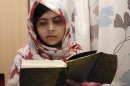 FILE - In this undated file photo provided by Queen Elizabeth Hospital in Birmingham, England, Malala Yousufzai, the 15-year-old girl who was shot at close range in the head by a Taliban gunman in Pakistan, reads a book as she continues her recovery at the hospital. doctors said Wednesday, Jan. 30, 2013, that Yousufzai is headed toward a full recovery once she undergoes a final surgery to reconstruct her skull. (AP Photo/Queen Elizabeth Hospital, File)